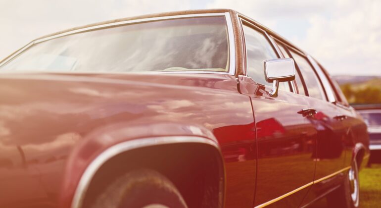 Retro car parked on grass
